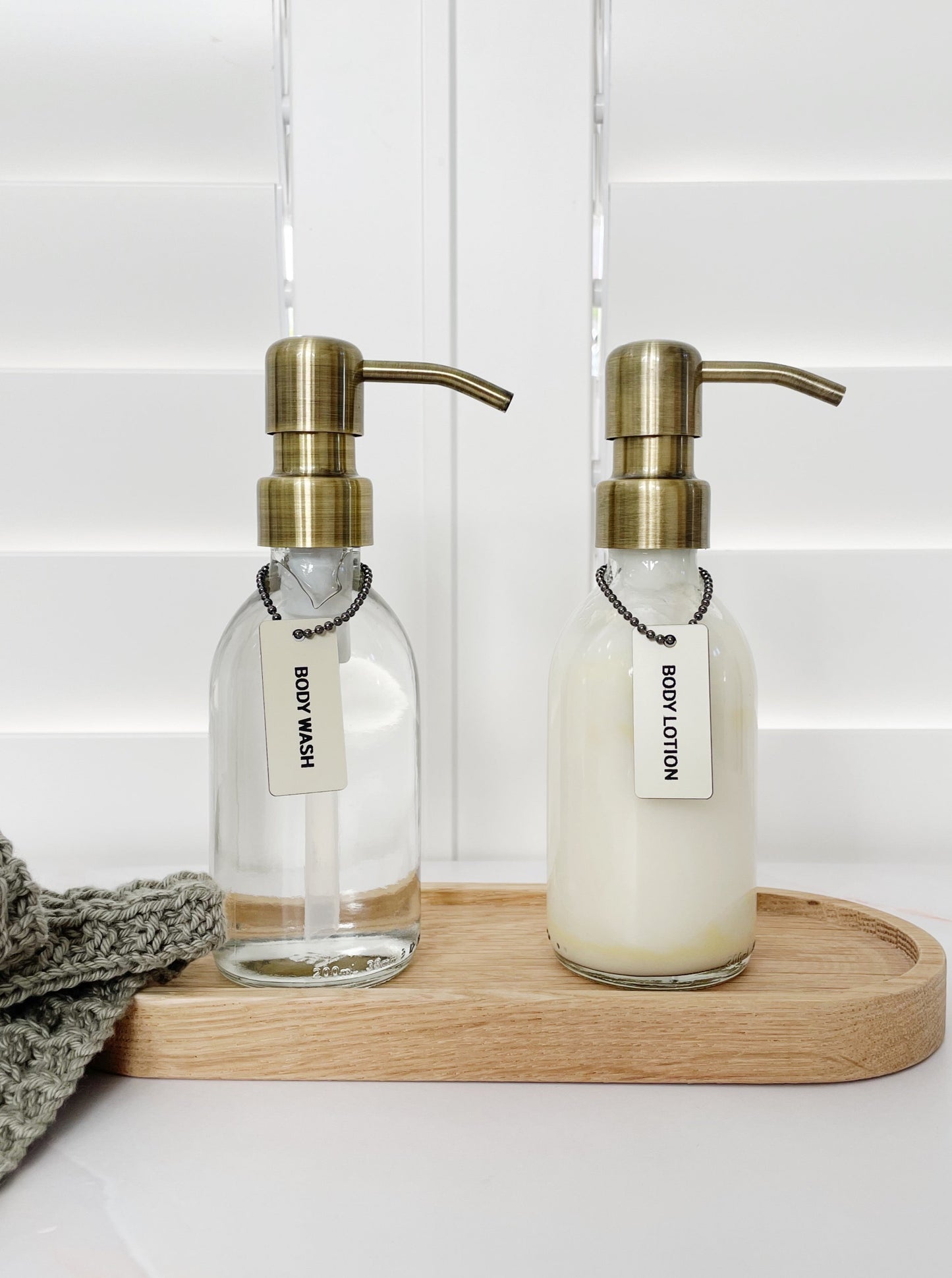 Clear Glass Dispenser Bottle with Bronze Pump