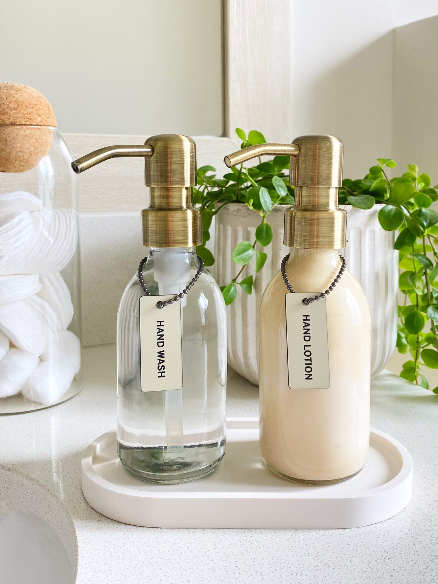 Clear Glass Dispenser Bottle with Bronze Pump